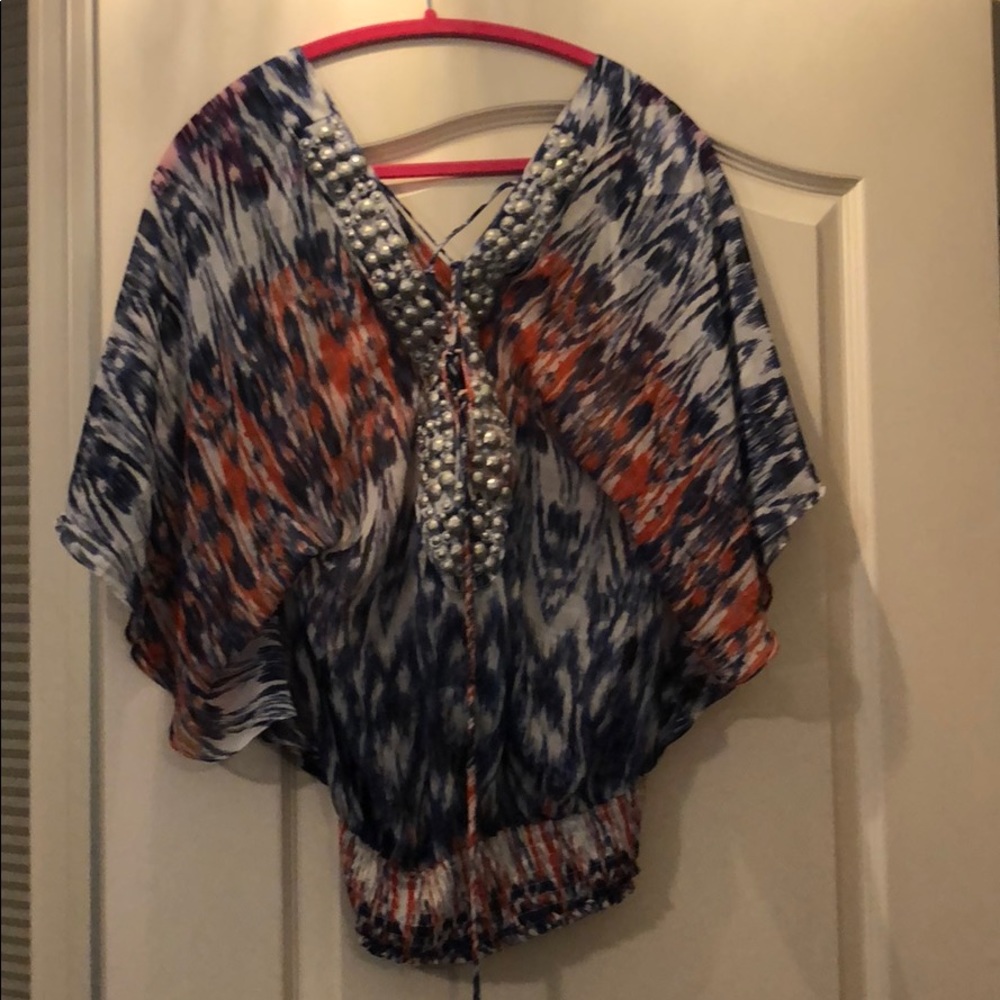3/4 sleeve see through shirt with beading detail.